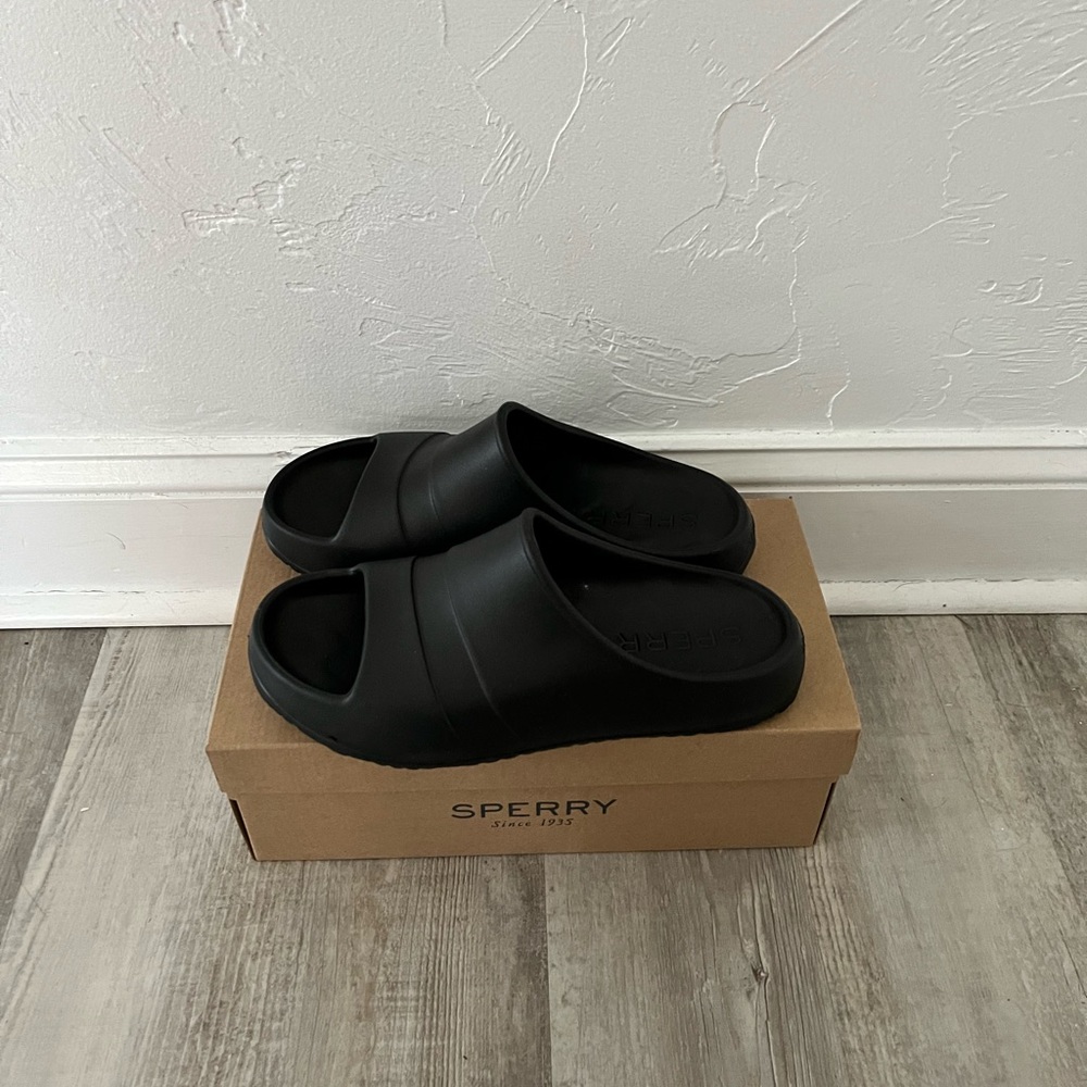 2 black and white Sperry sandals